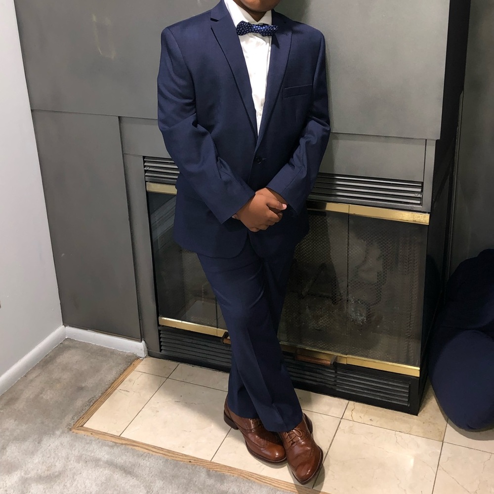 Boys navy blue suit Joseph Abboud with white dress shirt and blue bow tie